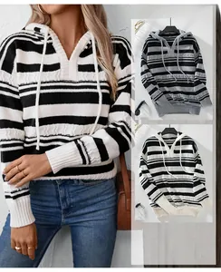 Detail of V-neck striped knit hoodie with drawstring and cable knit texture in grey and apricot
