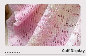 Macro shot of pink bohemian lace cuffs with detailed openwork knit patterns