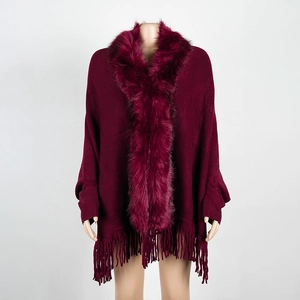 Women's wine red knit poncho with luxurious faux fur collar and fringed hemline