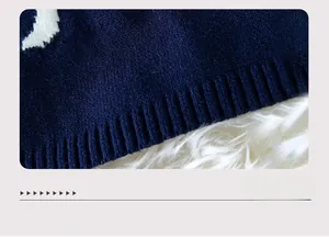Detailed close-up of dark blue knit sweater ribbed hem showing high-quality fabric texture
