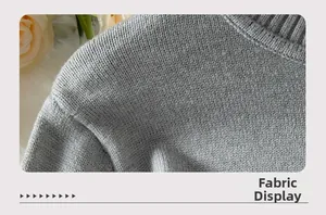 Close-up of gray fine knit fabric detail with elegant collar and shoulder stitching
