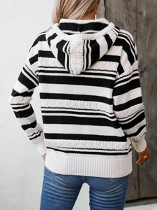 Back view of striped hooded knit sweater for women with drawstring and ribbed hem