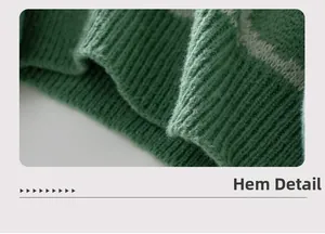 Detailed macro view of the green ribbed sweater hemline and knit fabric texture