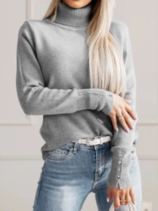 Elegant grey turtleneck knit sweater with decorative buttoned cuffs for autumn and winter