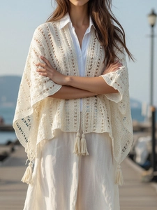 Bohemian knit shawl with fringe details and hollow crochet pattern in cream white finish