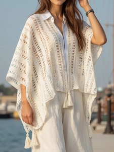 White boho crochet knit poncho with fringe details and tassel drawstring for beachwear