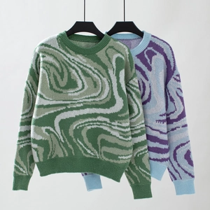 Close-up of ribbed cuffs and marble pattern jacquard knit texture on Y2K sweaters
