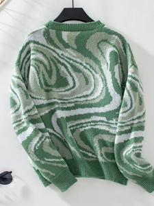 Detail of ribbed neckline and cuffs on green and white marble pattern knit sweater