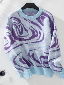 Detail of blue and purple abstract marble pattern knit sweater with ribbed cuffs