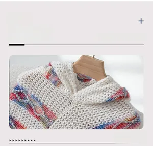 Detail shot of the knit hood and V-neckline on this colorful striped tassel poncho sweater