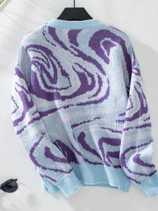 Detail of blue and purple swirl jacquard knit texture on a Y2K style crewneck sweater