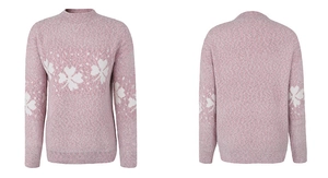 Detail view of pink knitted Christmas sweater with white snowflake jacquard patterns