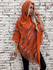 Orange striped knit hooded poncho with bohemian fringe tassels and baggy sleeves