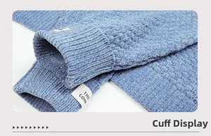Detailed close-up of blue chenille knit sweater ribbed cuffs with woven textile label