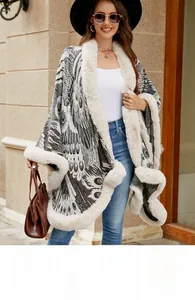 Detailed view of the luxury faux fur collar and peacock knit texture on a gray cape