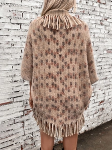 Women knit poncho sweater with leopard pattern, tassel hem and cozy bohemian style