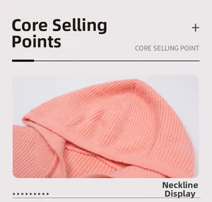 Détails de la capuche en tricot et de l'encolure côtelée sur un sweat rose-orange