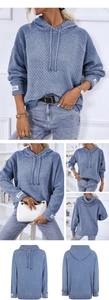 Blue waffle knit hooded sweater featuring a relaxed fit and decorative cuff labels