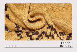 Detail of mustard yellow and brown jacquard knit fabric with small silver bead accents