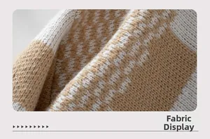 Detailed macro view showing the beige and white checkerboard knit texture and soft fabric