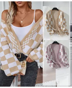 Detail of checkered knit cardigan showing V-neck design and soft autumn texture