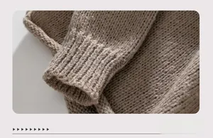 Close-up of thick rib-knit cuffs in brownish grey wool with detailed texture