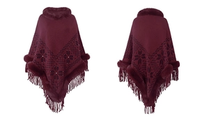 Detail of wine red knit poncho with faux fur trim, snowflake pattern and fringe hem