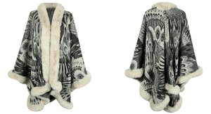 Close-up of black and white peacock pattern knit poncho with faux fur trim