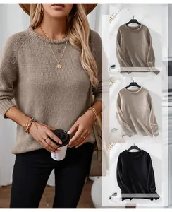 Detail view of chunky knit texture and drop shoulder design on a casual women sweater