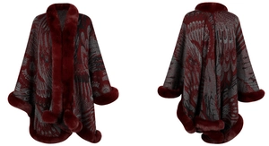 Detail of the knit poncho showing vintage peacock jacquard pattern and faux fur trim finish