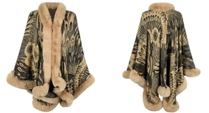 Detail of peacock jacquard knit cape with premium faux fur trim and warm textures