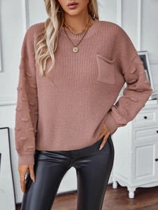 Women's solid color loose knit sweater with pocket and stylish puff sleeves