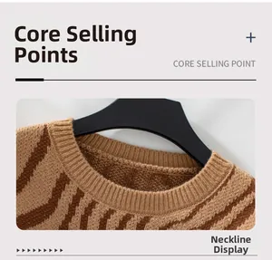 Detail of ribbed crew neck on zebra pattern knit sweater with thick brown striped texture