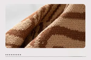 Detailed macro shot of brown and beige zebra pattern knit fabric with soft texture