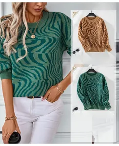 Close-up of zebra pattern knitted texture and crew neck detail on oversized sweater