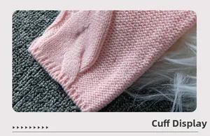 Close-up of pink cable knit sweater cuff showing fine texture and soft material