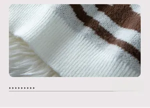 Detailed view of the soft ribbed hem on a zebra pattern knit sweater for women