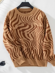 Detail of ribbed crew neck and brown zebra pattern texture on knit sweater