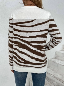 Women's zebra pattern knit sweater with long sleeves and shoulder buttons in brown and white