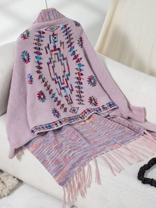 Detail of lavender Aztec knit cardigan showing vibrant ethnic pattern and fringe hem