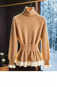 Detail of apricot knit top featuring golden buttons and delicate white floral lace edges