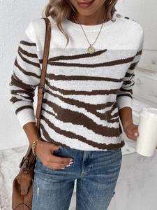 Women's zebra print crew neck sweater with gold shoulder buttons and long sleeves