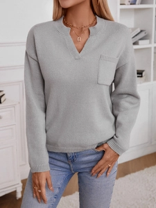 Women's casual grey knit sweater with V-neckline, chest pocket, and relaxed fit style