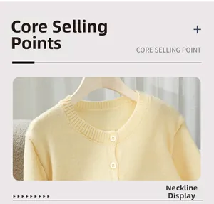 Close-up of the round neckline and buttons on this soft yellow knitted cardigan