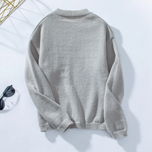 Rear view of light grey knit sweater featuring ribbed collar and loose casual fit design
