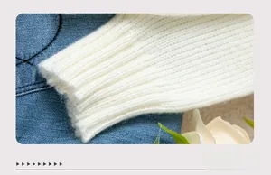 Macro view of white ribbed knit sweater cuff made from high-quality soft wool blend