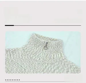 Detail of high neck knit cardigan with a metal ring zipper and coarse marled texture