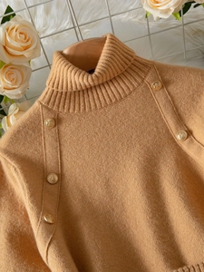 Elegant camel knit sweater for women featuring a turtle neck and vintage gold buttons