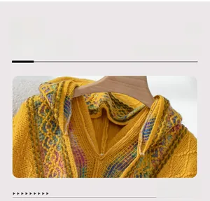 Detailed macro view showing the yellow knit hooded sweater with colorful jacquard collar