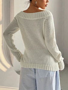 Minimalist white off-shoulder knit sweater with ribbed texture and back view details